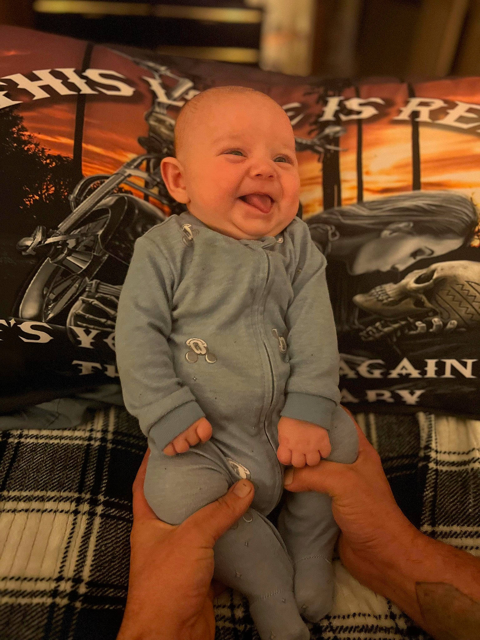 Layne is registered to the contest to win money with this photo: baby, baby_toddler_clothing, bicycle_tire, bicycle_wheel, chair, cheek, child, comfort, flooring, fun, happy, human_leg, lap, pattern, person, sitting, skin, smile, thigh, thumb