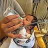 baby, newborn, bottle, feeding, hospital, blanket, person, hand, medical_equipment, bed, nail_polish, infant, healthcare, care, wrapped, closeup, indoors, tubing, resting, patient