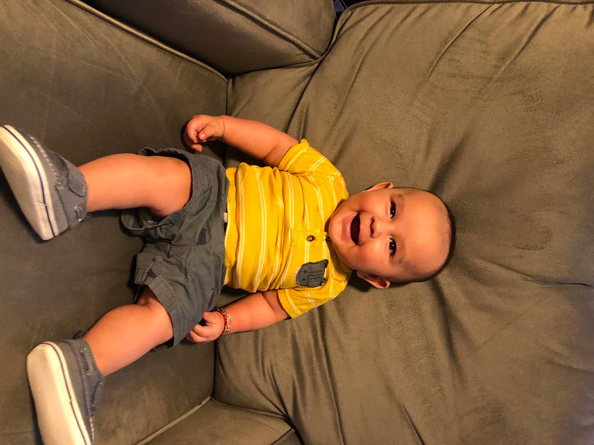 Everardo is registered to the contest to win money with this photo: arm, baby, baby_toddler_clothing, chair, child, comfort, elbow, finger, flash_photography, fun, hat, human_leg, joint, joy, knee, muscle, orange, person, sitting, thigh