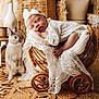 baby, newborn, rabbit, wicker_basket, lace, blanket, sleeping, nursery, vintage, wicker_wheels, barefoot, headband, bow, cozy, adorable, pet, indoor, soft_light, boho, portrait