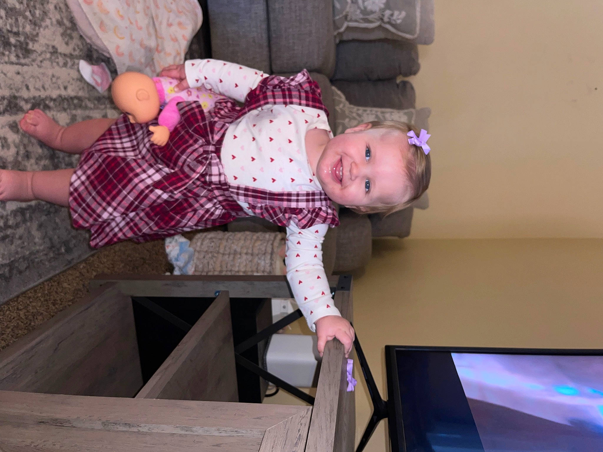 Lailiana joined the competition — help win amazing prizes! baby, baby_toddler_clothing, child, flat_panel_display, fun, gadget, joy, leg, magenta, output_device, pattern, person, pink, plaid, room, sitting, smile, sock, tartan, toddler
