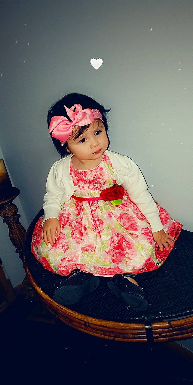 Anahi joined the competition — help win amazing prizes! baby, cheek, child, dress, eye, headgear, headwear, peach, person, photography, pink, sitting, smile, toddler