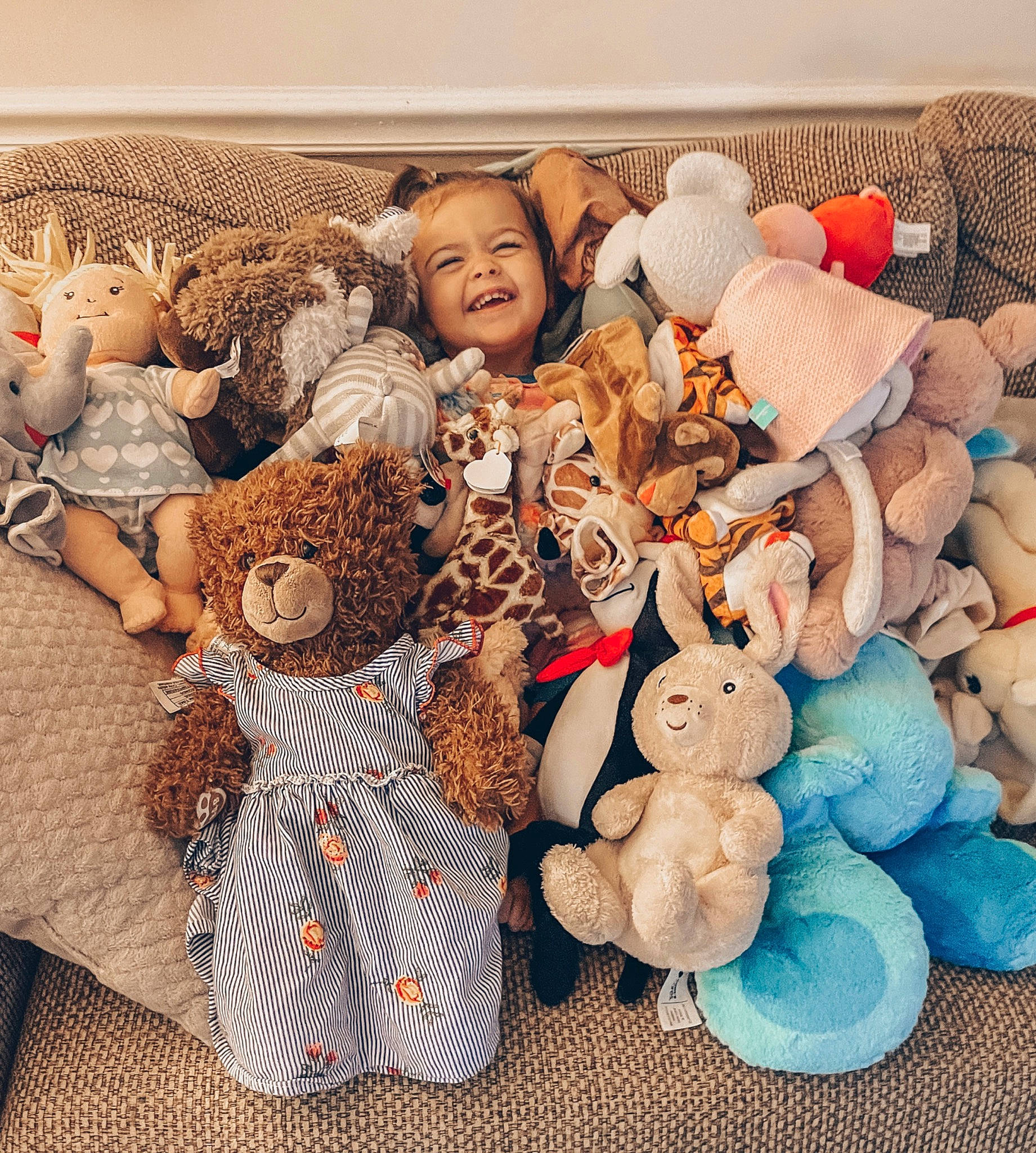 Hattie is registered to the contest to win money with this photo: art, baby_toys, child, doll, event, fur, happy, joy, linens, mammal, pattern, peach, person, plush, room, smile, stuffed_toy, teddy_bear, toy, visual_arts