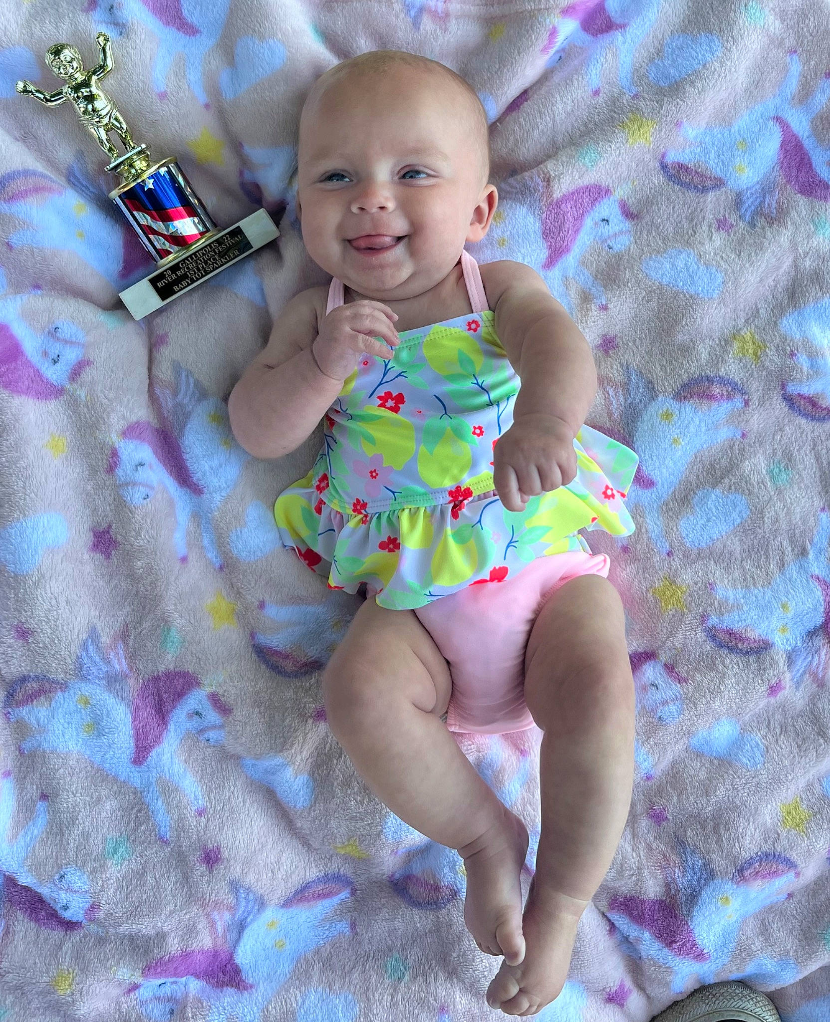 Kaylynn is registered to the contest to win money with this photo: baby, baby_toddler_clothing, child, day_dress, dress, eye, face, happy, head, joy, leg, magenta, pattern, person, pink, purple, skin, sleeve, smile, textile