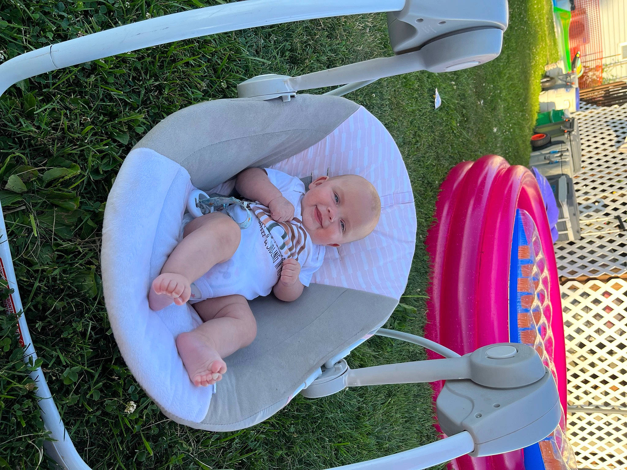 Kaylynn is registered to the contest to win money with this photo: baby, baby_products, baby_toddler_clothing, child, circle, comfort, fun, grass, green, joy, lap, leisure, outdoor_furniture, person, pink, play, product, recreation, sitting, toddler