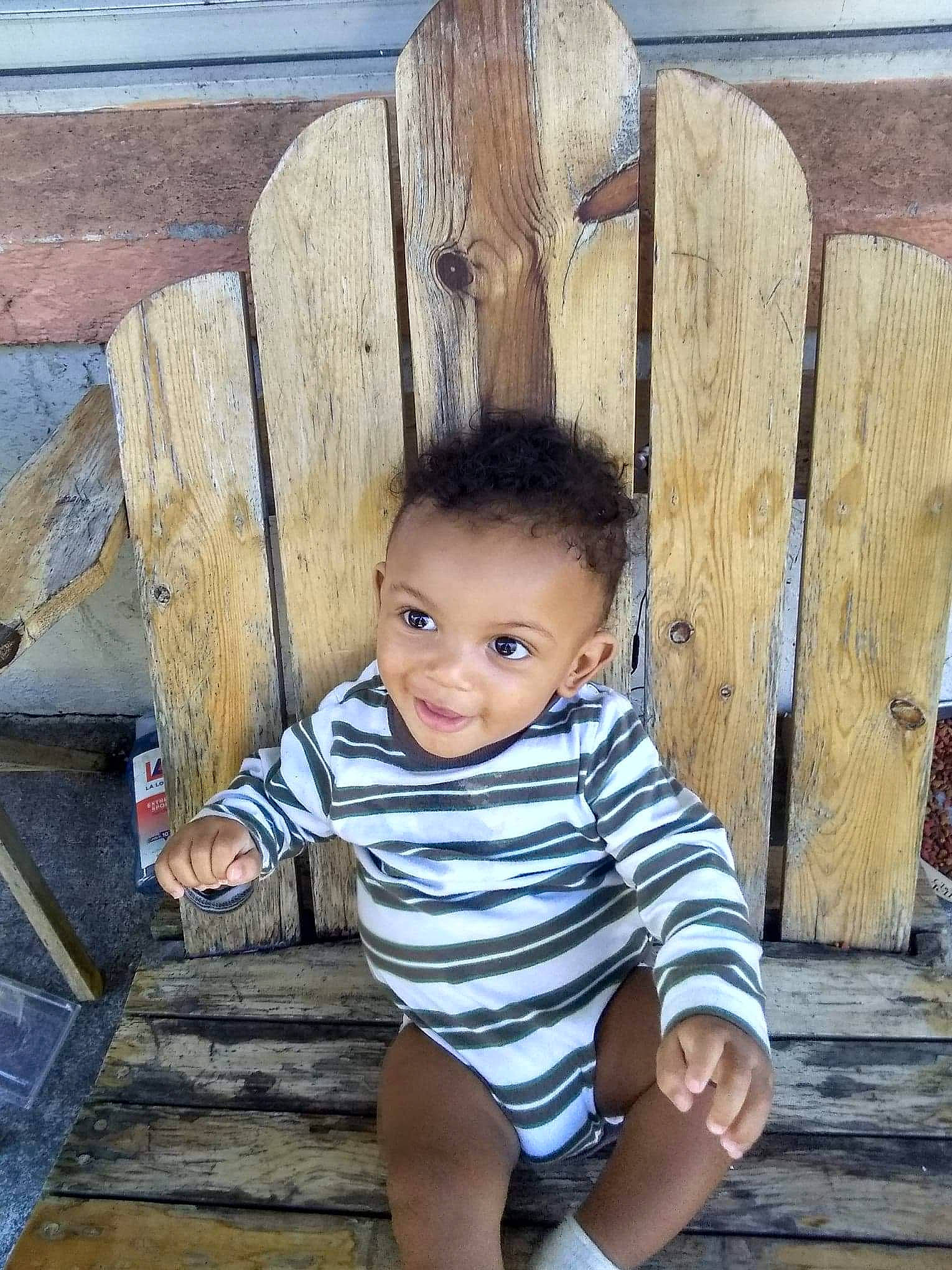 Jeremiah joined the competition — help win amazing prizes! child, face, head, joy, people, person, plant, sitting, skin, smile, toddler, tree, vacation, wood