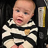 baby, black_and_white, blue_eyes, canopy, car_seat, child, chubby_hands, closeup, cute, human, indoors, infant, onesie, portrait, seat_buckle, skin, smile, striped_clothing, teddy_patch, warning_label