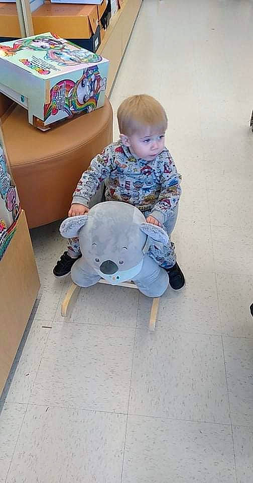 Waylyn is registered to the contest to win money with this photo: baby, box, cardboard, carton, child, comfort, companion_dog, floor, flooring, fun, leisure, packaging_and_labeling, paper_product, person, personal_protective_equipment, play, shipping_box, sitting, sneakers, toddler