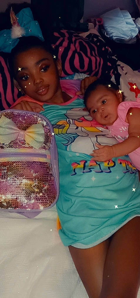 Aaliyah is registered to the contest to win money with this photo: arm, baby_toddler_clothing, beauty, child, event, eye, face, fun, happy, head, leisure, organ, person, photograph, pink, skin, smile, t_shirt, textile, thigh