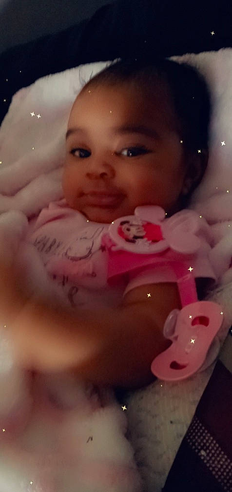 Khalia is registered to the contest to win money with this photo: baby, cheek, chest, child, event, eye, eyelash, fun, happy, head, headgear, human_body, lip, nose, party_supply, person, pink, product, skin, toddler