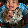 Alexander is registered to the contest to win money with this photo: baby, smiling, child, infant, happy, blue, toys, seat, clothing, playful, cute, hands, face, indoor, expression, young, joyful, person, sitting, colorful