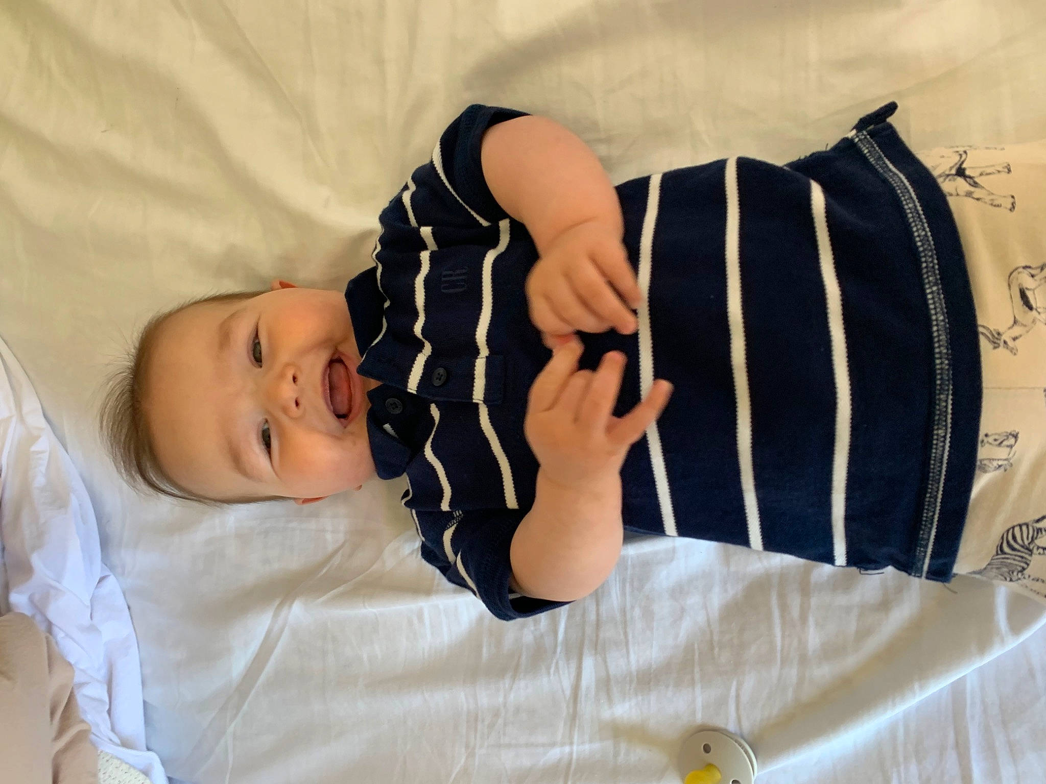 Archie is registered to the contest to win money with this photo: arm, baby, baby_sleeping, baby_toddler_clothing, child, collar, comfort, elbow, fashion_accessory, gesture, human_leg, knee, linens, pattern, person, sleeve, t_shirt, thigh, toddler, waist