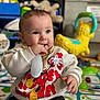 Maëlan participe au concours pour gagner de l'argent avec cette photo : baby, background, brush, child, colorful, cute, expression, face, hand, indoor, infant, mickey_mouse, person, playmat, playroom, seated, smiling, sweatshirt, toy, young_child