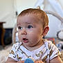 baby, blue_brush, child, chubby_cheeks, closeup, curious, cute, expression, face, hands, holding, human, indoor, infant, onesie, person, portrait, soft_light, tiger_print, young