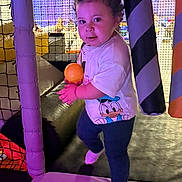 Malik joined the competition — help win amazing prizes! ball, child, colorful, curly_hair, cute, donald_duck_print, fun, indoor_play_area, leggings, netting, padded_poles, person, playground, purple_lighting, smile, socks, soft_play, standing, toddler, white_tshirt