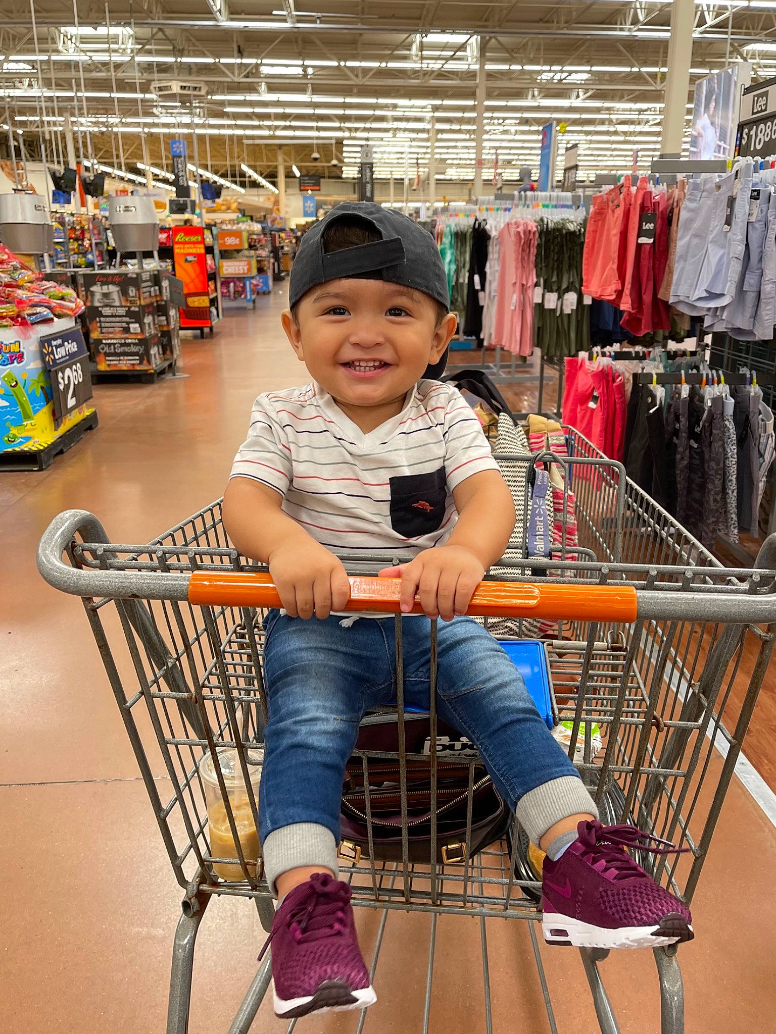 Gael is registered to the contest to win money with this photo: bag, customer, fun, hat, headwear, joy, luggage_and_bags, person, photograph, product, retail, service, shelf, shoe, shopping, shopping_cart, smile, sneakers, t_shirt, tire