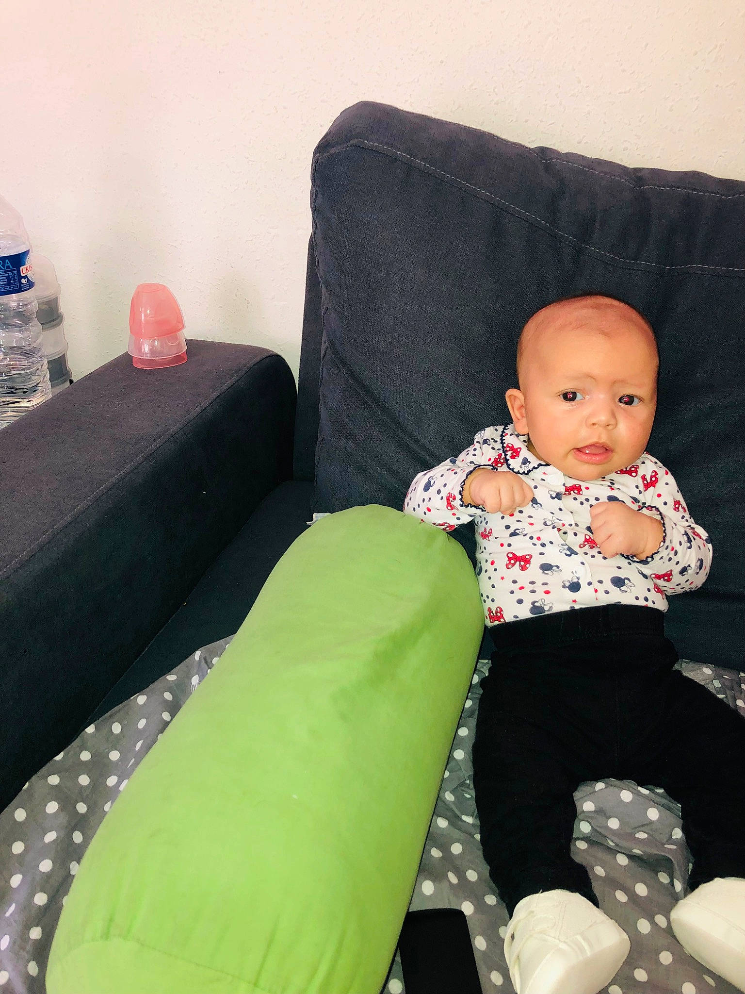 Ilanna participe au concours pour gagner de l'argent avec cette photo : baby, baby_toddler_clothing, balloon, black, child, comfort, couch, design, furniture, linens, living_room, person, pillow, product, room, sitting, sleeve, sofa_bed, studio_couch, throw_pillow