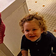 Lucyan participe au concours pour gagner de l'argent avec cette photo : appliance, cabinet, child, clothing, curly_hair, curly_hair_child, floor_tiles, happy, household, indoor, kitchen, motion_blur, oven, person, playful, potty_seat, small_object, smiling, toddler, white_socks