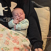 Hazely is registered to the contest to win money with this photo: baby, sleeping, blanket, floral, onesie, child, person, hand, couch, pillow, clothing, arm, cozy, resting, indoor, portrait, cute, peaceful, soft, relaxation