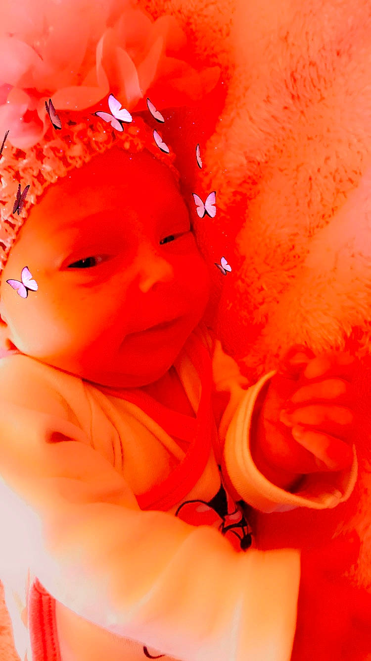 Tchelssy participe au concours pour gagner de l'argent avec cette photo : baby, baby_toddler_clothing, cheek, child, chin, clothing, eye, face, happy, head, human_body, lip, orange, peach, person, petal, pink, red, skin, smile