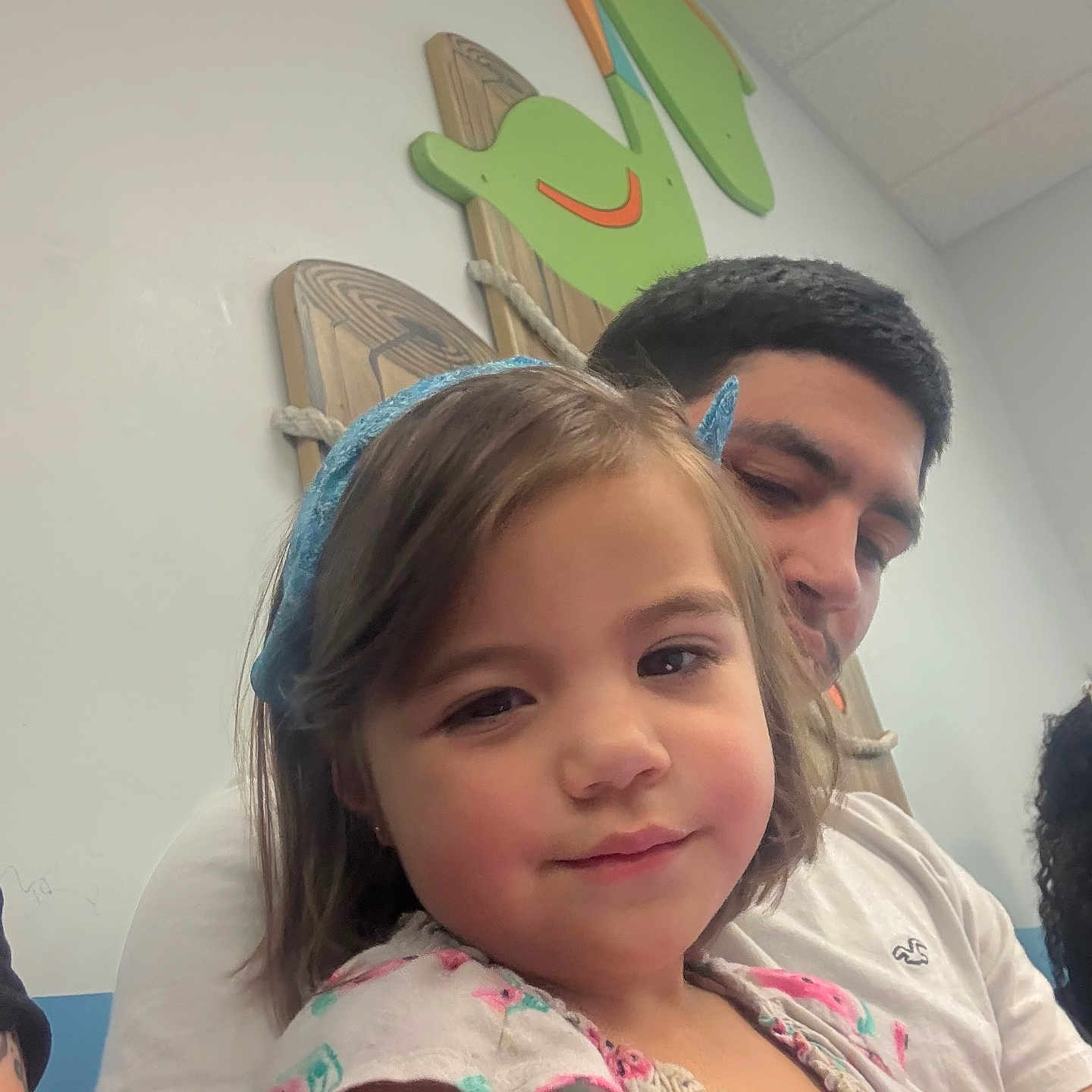 Rosabella joined the competition — help win amazing prizes! beard, casual_clothing, child, close_up, colorful, family, floral_dress, girl, happy, headband, indoor, man, people, playful, portrait, seated, short_hair, smile, wall_decoration, wooden_art