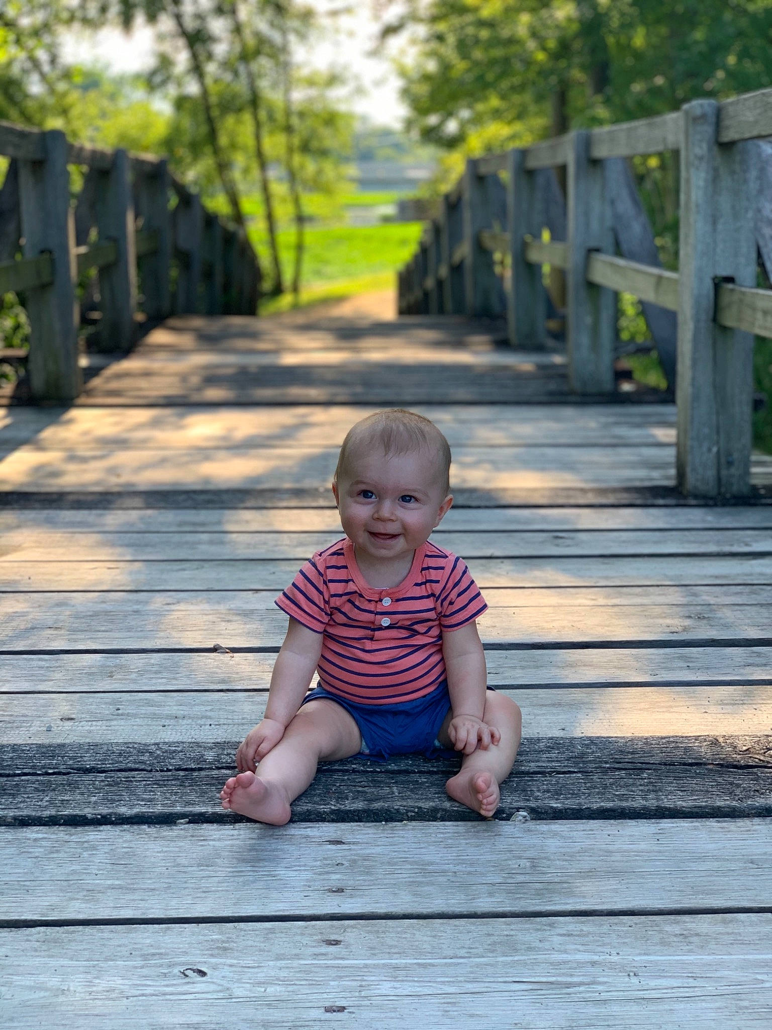 Brody is registered to the contest to win money with this photo: child, grass, green, leaf, leisure, people, person, photograph, photography, pink, plant, sitting, smile, standing, summer, toddler, tree, vacation, walkway, water