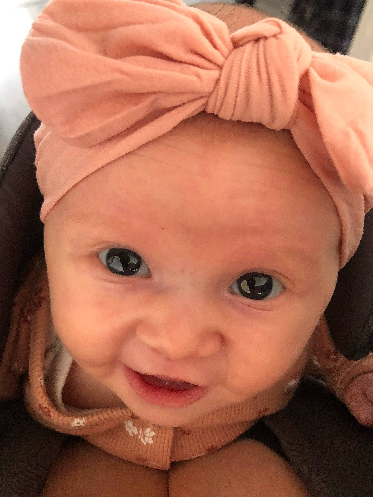 Harper is registered to the contest to win money with this photo: baby, cheek, chin, ear, eyelash, hair, happy, headgear, headwear, human, human_body, iris, lip, mouth, neck, nose, organ, person, pink, skin