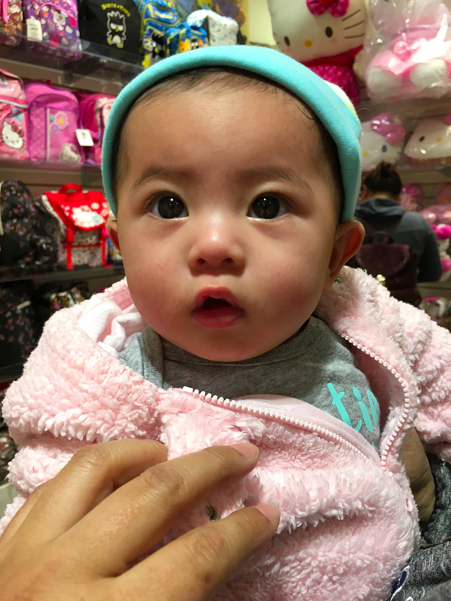 Mara  is registered to the contest to win money with this photo: baby, cheek, child, face, head, headwear, person, pink, skin, smile, toddler