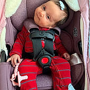 Rose joined the competition — help win amazing prizes! baby, car_seat, graco, pajamas, red_clothing, striped_clothing, pacifier, pink_pacifier, infant, child, face, head, hair_bow, socks, mouse_design, seat_belt, safety_harness, hand, portrait, indoor