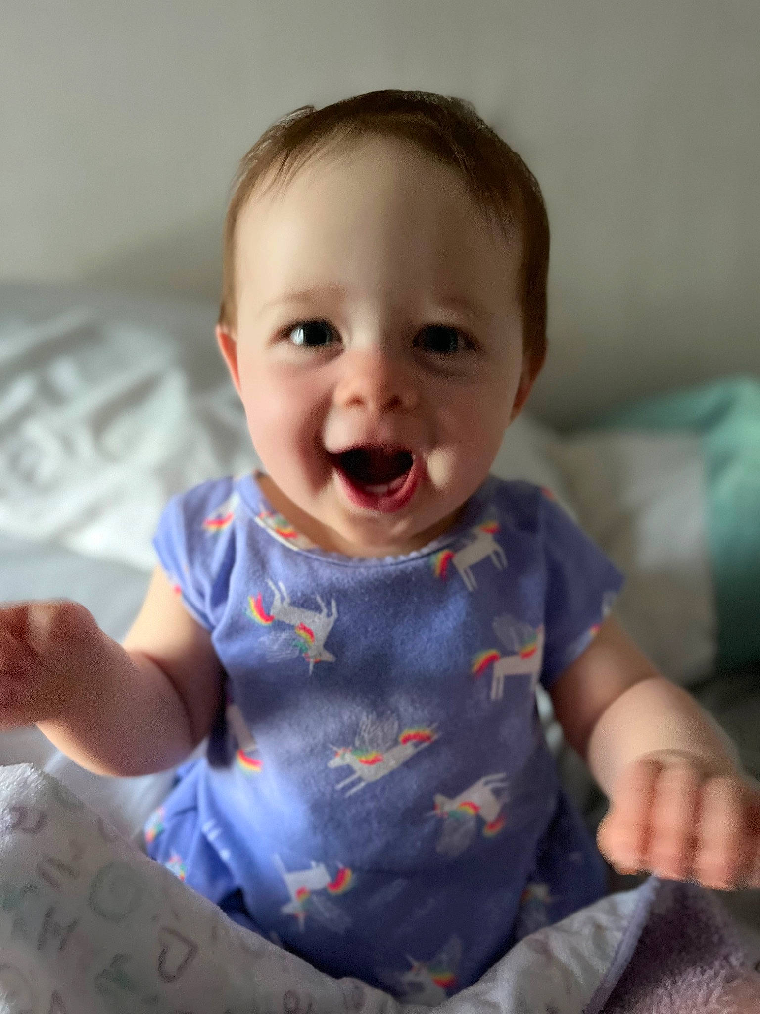 Tiffany is registered to the contest to win money with this photo: baby, baby_toddler_clothing, cheek, child, chin, comfort, eye, face, finger, fun, gesture, hand, happy, iris, person, sitting, skin, sleeve, smile, t_shirt