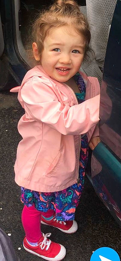 Siena is registered to the contest to win money with this photo: baby, cheek, child, child_model, cool, face, facial_expression, head, joy, outerwear, person, pink, skin, sleeve, smile, toddler