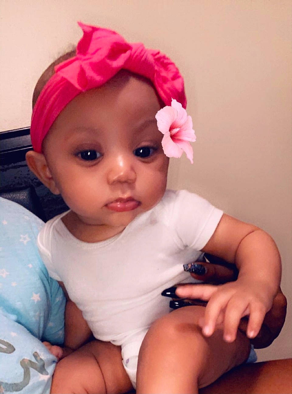 Jaliyah joined the competition — help win amazing prizes! arm, baby, baby_toddler_clothing, cap, cheek, chin, comfort, eye, eyebrow, finger, flower, hair, head, headwear, iris, lip, mouth, person, petal, pink