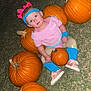 child, toddler, pumpkin, grass, outdoor, headband, pink_shoes, blue_leg_warmers, face, person, autumn, fall, costume, cute, sitting, night, flash_photo, orange, toy, holiday