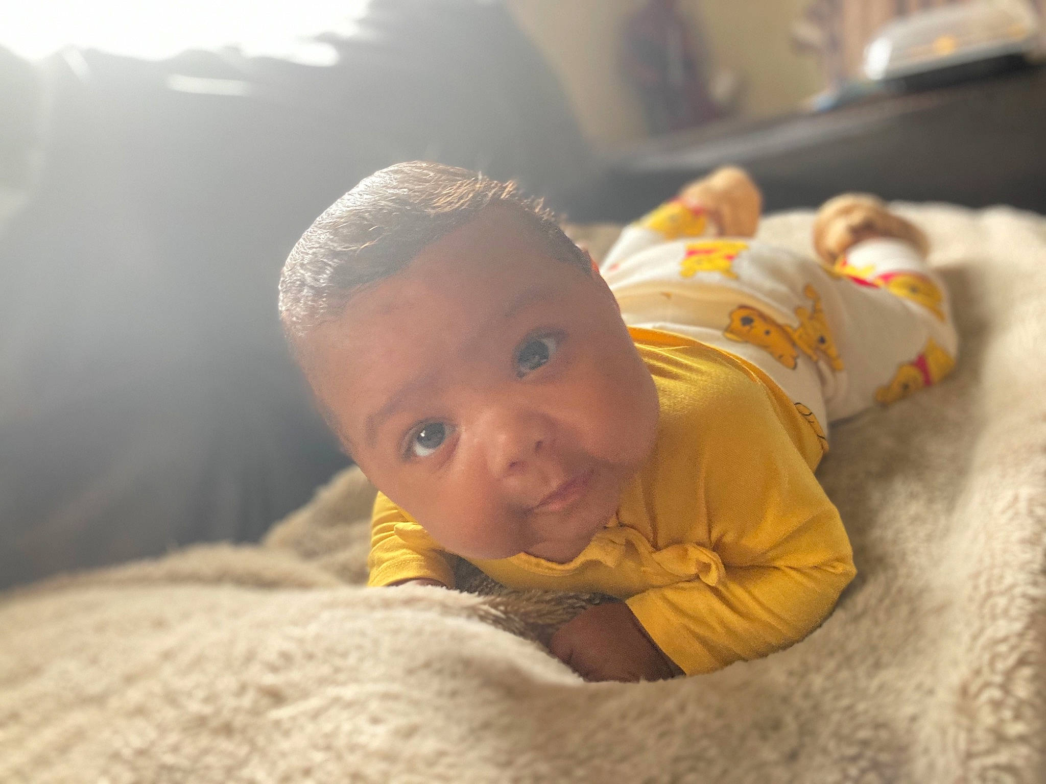 Unai is registered to the contest to win money with this photo: baby, baby_toddler_clothing, bedtime, cheek, child, comfort, ear, flooring, fur, happy, human_body, linens, person, portrait_photography, sitting, skin, sleep, smile, toddler, tummy_time