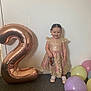 Harper-Mae is registered to the contest to win money with this photo: toddler, child, balloon, number_two, party, dress, pink, gold, carpet, wall, celebration, footwear, smile, standing, indoor, happy, person, sock, shoe, birthday