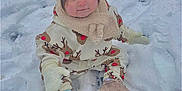 Harper-Mae joined the competition — help win amazing prizes! toddler, child, snow, winter_clothing, hat, mittens, shoes, outdoor, cute, cold_weather, sitting, reindeer_pattern, playful, winter, face, person, young_child, smile, rosy_cheeks, snowy_background