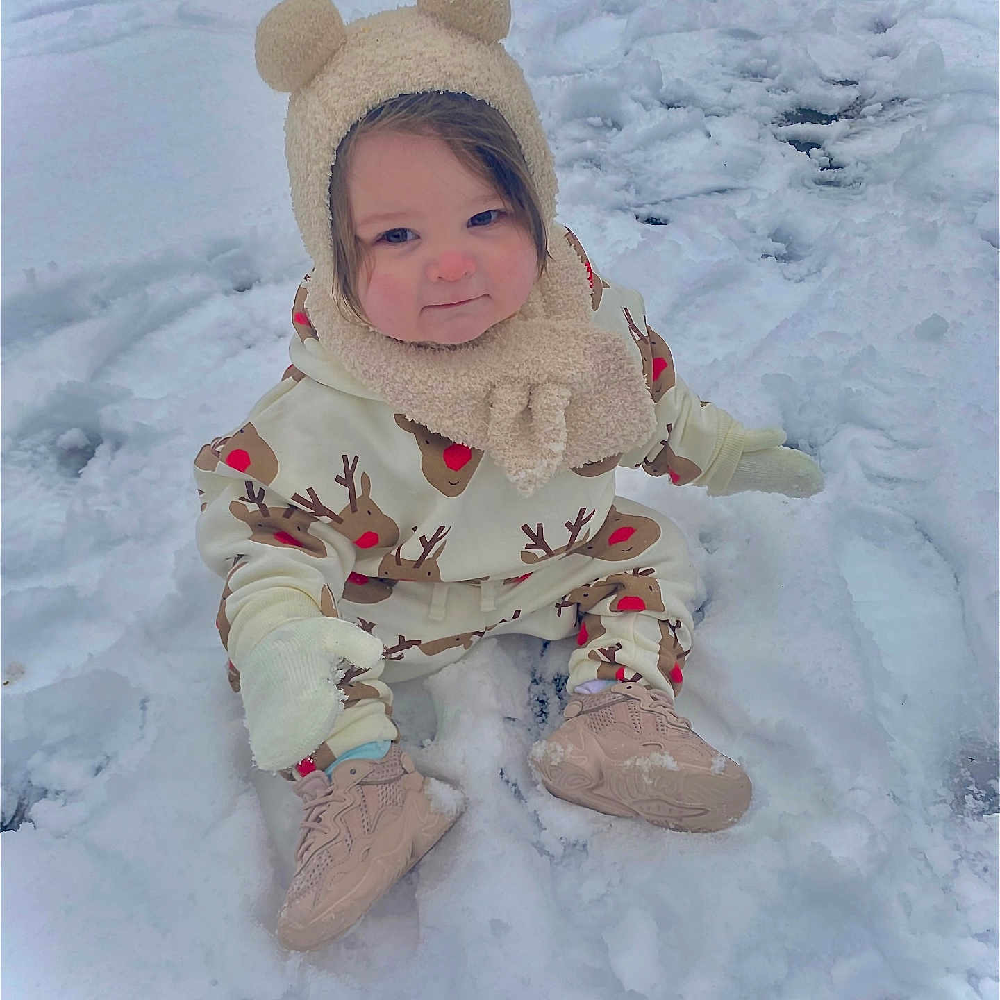 Harper-Mae joined the competition — help win amazing prizes! child, cold_weather, cute, face, hat, mittens, outdoor, person, playful, reindeer_pattern, rosy_cheeks, shoes, sitting, smile, snow, snowy_background, toddler, winter, winter_clothing, young_child