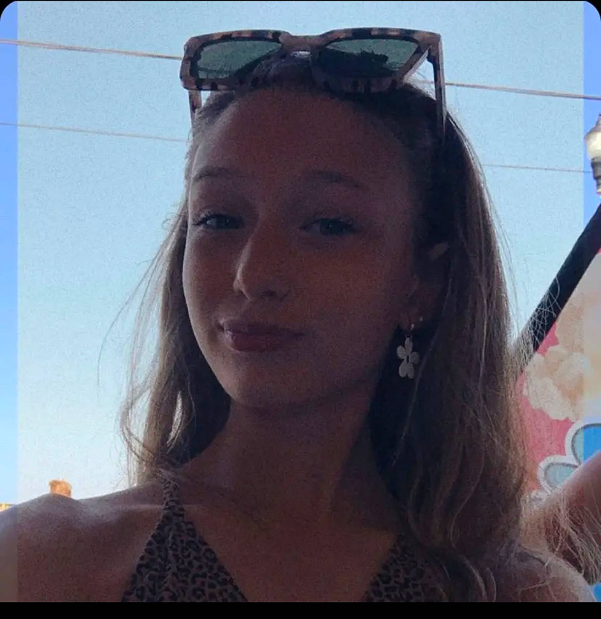 Skyelynne is registered to the contest to win money with this photo: azure, black_hair, blue, chin, cool, eyebrow, eyelash, eyewear, flash_photography, forehead, happy, jaw, layered_hair, lip, mouth, neck, person, photograph, sky, smile