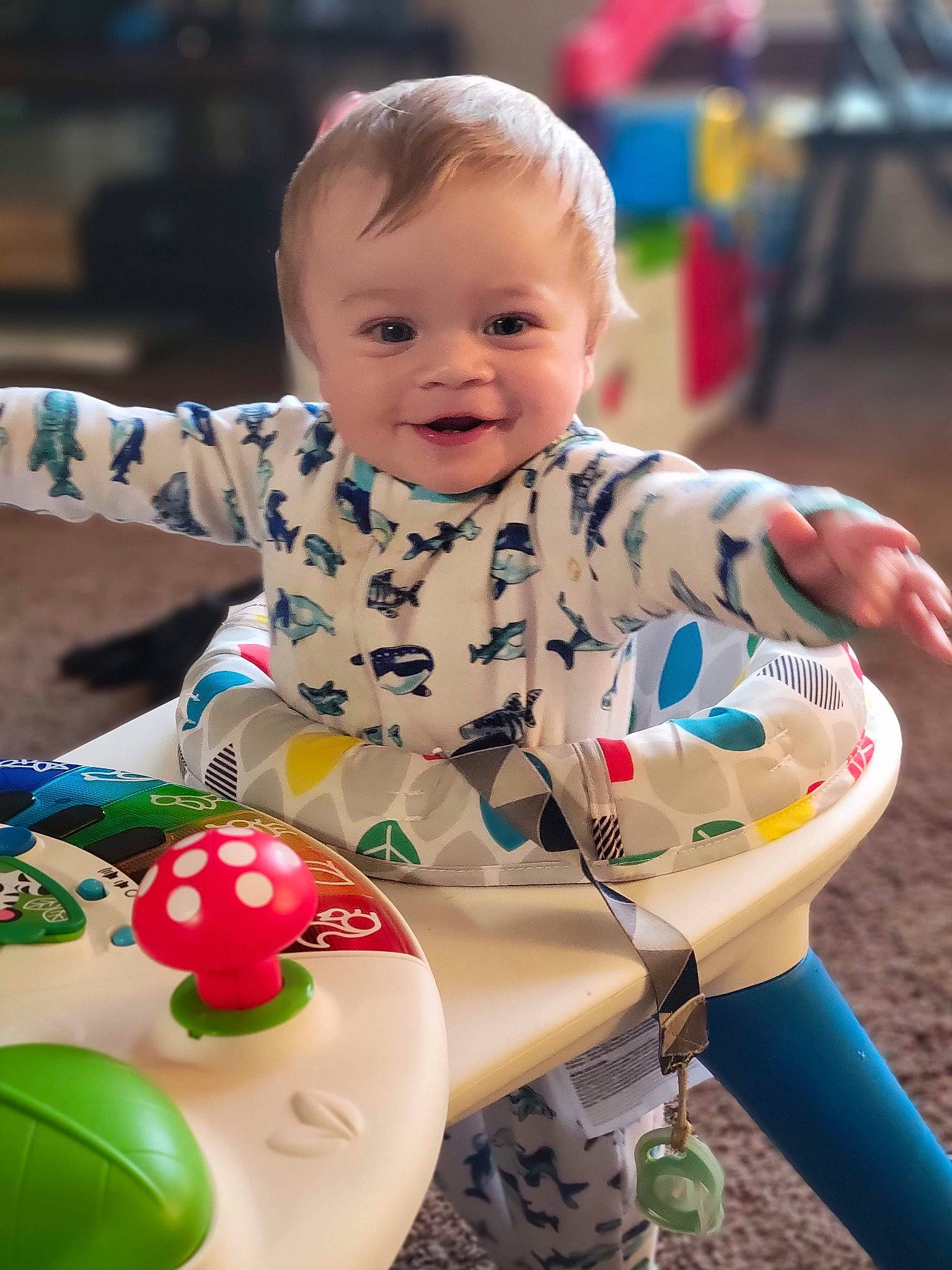 Tate is registered to the contest to win money with this photo: baby, baby_playing_with_toys, baby_toddler_clothing, cheek, eye, face, facial_expression, fun, grass, hairstyle, happy, head, human, joy, leisure, organ, person, photograph, red, skin