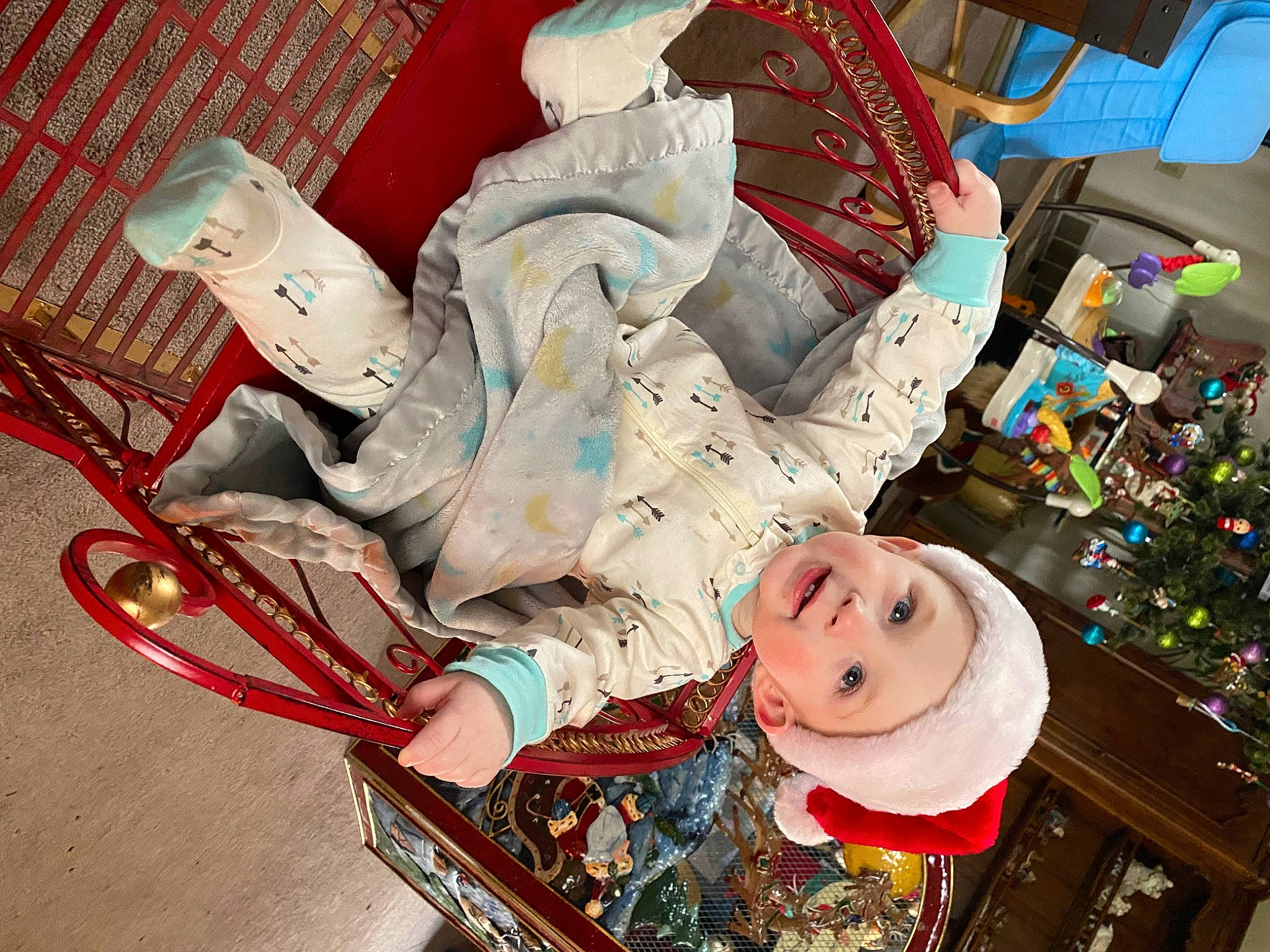 Jonathan is registered to the contest to win money with this photo: baby_carriage, baby_products, baby_toys, carmine, child, comfort, event, fictional_character, fun, headwear, holiday, lap, person, plastic, room, smile, toy