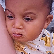 Braxton joined the competition — help win amazing prizes! toddler, child, face, curly_hair, shirt, pattern, yellow_cars, arm, close_up, pensive, skin, indoors, expression, person, young_child, portrait, casual_clothing, looking_down, resting, cute