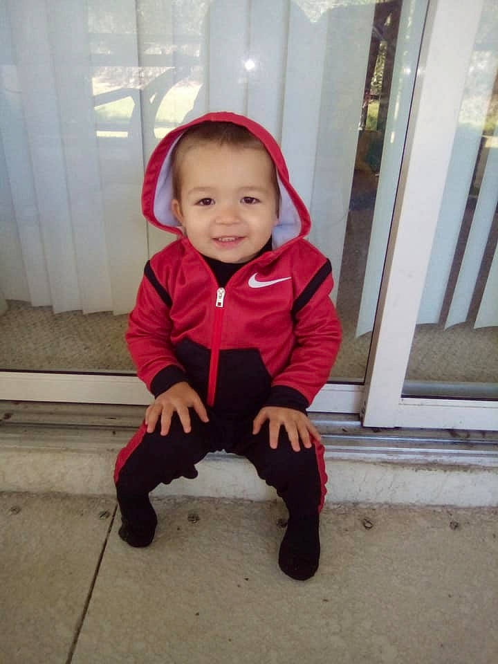 Jayce joined the competition — help win amazing prizes! baby, baby_toddler_clothing, carmine, child, concrete, costume, floor, flooring, fun, happy, hat, joy, magenta, pattern, person, sitting, sleeve, smile, t_shirt, toddler
