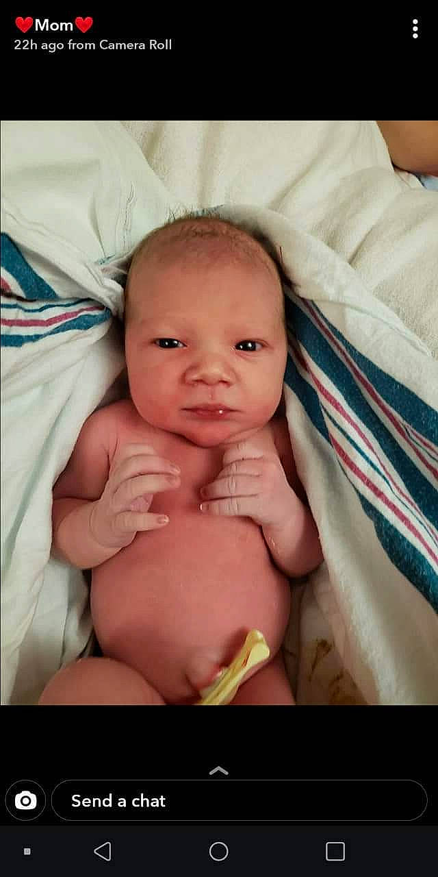 Hanna is registered to the contest to win money with this photo: baby, cheek, comfort, eye, eyelash, face, gesture, head, human_body, lip, mammal, mouth, nose, person, product, skin, smile, stomach, thumb, toddler