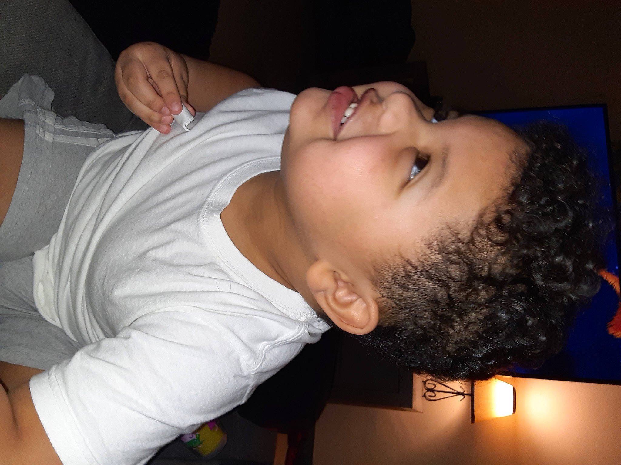 Malachai is registered to the contest to win money with this photo: arm, black_hair, cheek, child, chin, ear, forehead, gesture, head, jaw, joy, lip, mouth, muscle, neck, nose, person, skin, sleep