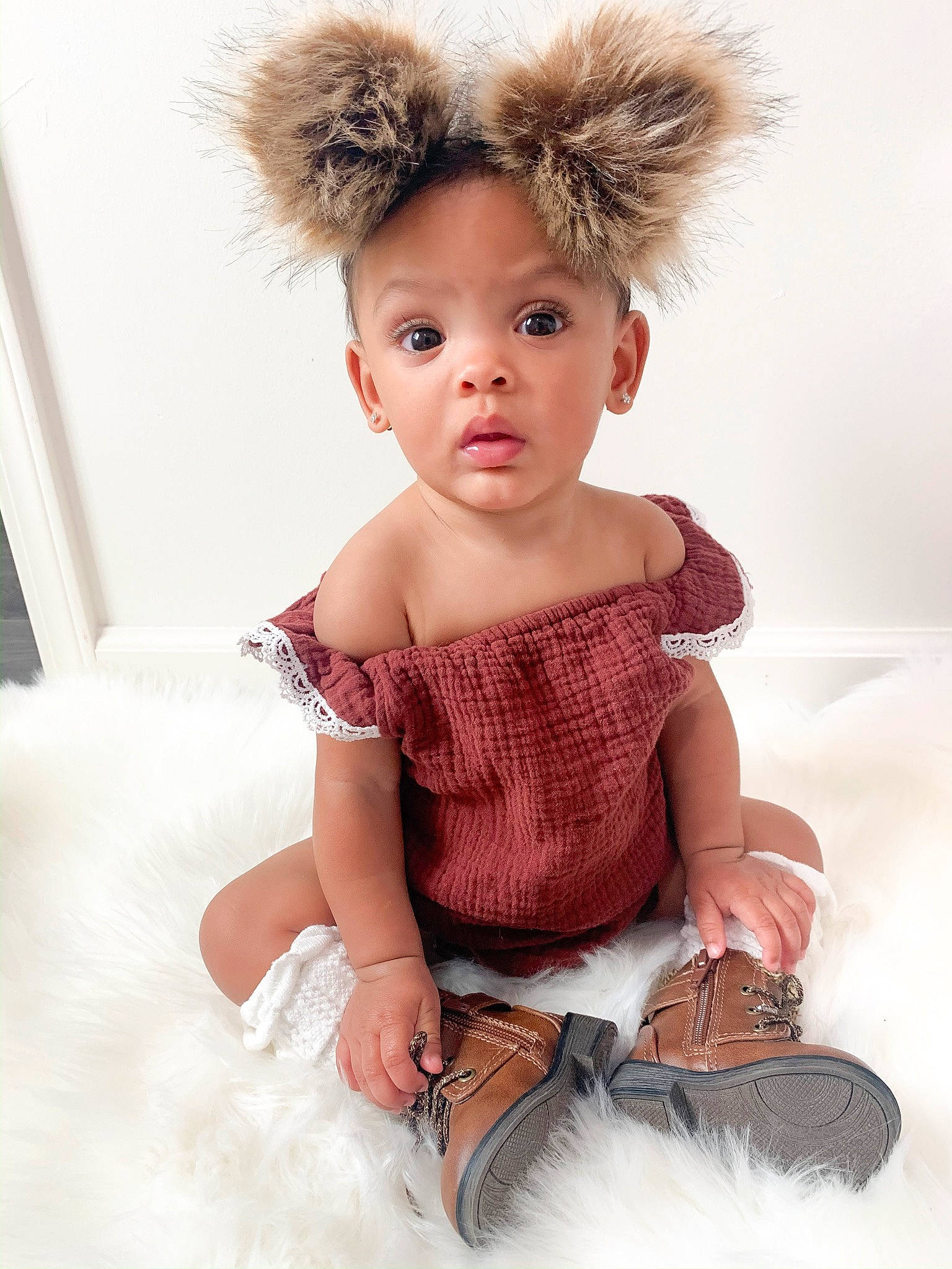 Aleiah is registered to the contest to win money with this photo: baby, blond, child, child_model, clothing, costume, costume_accessory, face, fur, fur_clothing, head, headgear, joint, person, photo_shoot, photography, pink, skin, surprise, textile