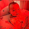 baby, baby_seat, blanket, child, clothing, comfort, cozy, cushion, cute, expression, face, head, indoor, infant, person, portrait, red_lighting, soft_furniture, wrapped, young