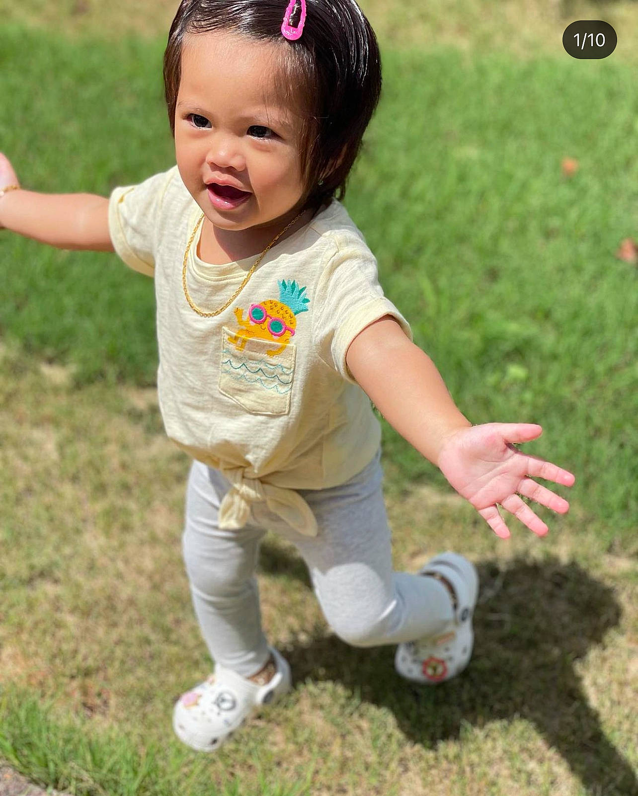 Mavis joined the competition — help win amazing prizes! baby_toddler_clothing, child, eye, finger, fun, gesture, grass, grass_family, happy, people_in_nature, person, plant, recreation, skin, sleeve, smile, sneakers, summer, thumb, toddler