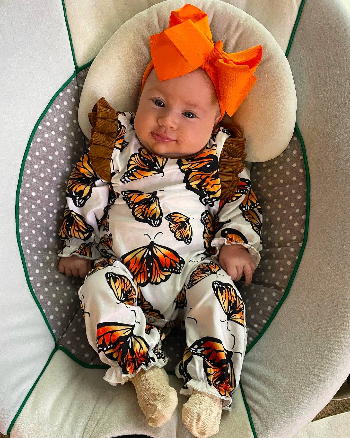 Halo joined the competition — help win amazing prizes! baby, baby_products, baby_safety, baby_toddler_clothing, cap, child, collar, comfort, face, happy, headwear, linens, orange, pattern, person, personal_protective_equipment, sitting, sleeve, smile, t_shirt