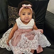 Gabriella a rejoint le concours — aidez-le/la à gagner de superbes lots ! baby, black_leather, child, couch, curly_hair, cute, decor, dress, fashion, girl, headband, indoor, lace, pillow, portrait, shoes, sitting, smiling, white_socks, young