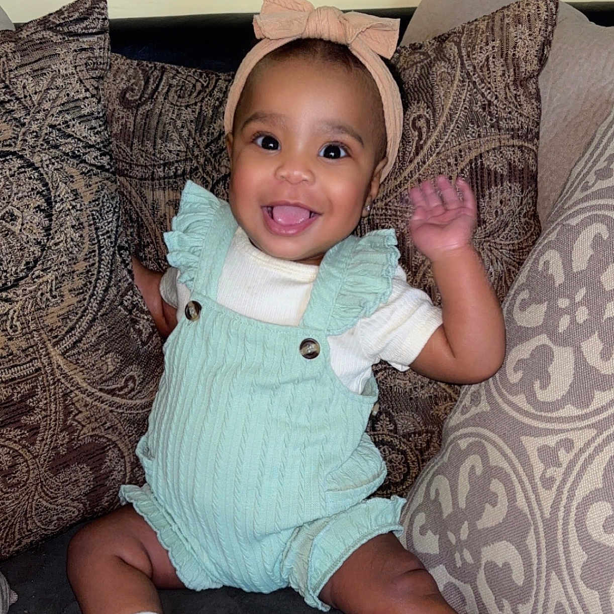 Riley joined the competition — help win amazing prizes! architecture, baby, building, clothing, couch, cushion, face, footwear, furniture, hat, head, homedecor, pants, person, photography, portrait, shoe, shorts, sitting, sneaker